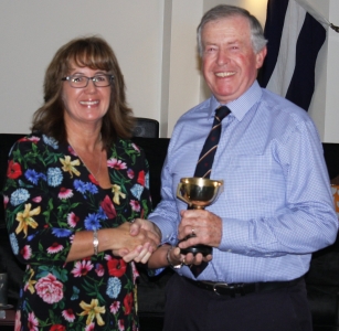 Malcolm Jolly is awarded the Gentlemen's Merit Trophy for services to the Club