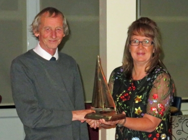 Club Treasurer Peter Downer is presented with the Gunfleet Chase Trophy - an open pursuit race that attracted visitors from other Clubs