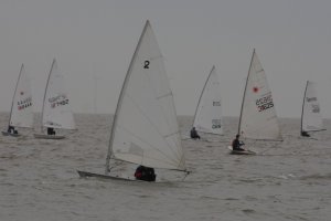 Dinghies jostle at the start line
