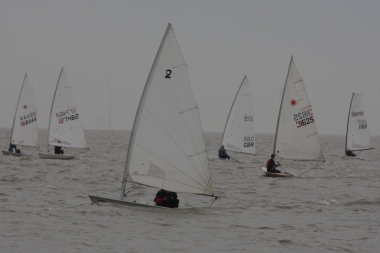 Dinghies jostle at the start line