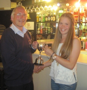 Beth Elliott collects the Dave Fowell Trophy for being the winning boat in the Topaz class