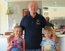 Otters Belle Hart and George Smith receive their prizes for the lifeboat picture painting competition