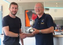 Andy Cornforth receives the Paxton Trophy for first Laser home