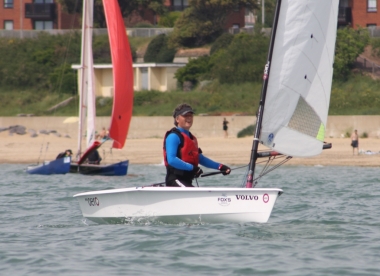 Visiting sailor Ben Powell takes his RS Aero to victory in the RNLI Charity Shield Race