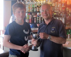 Finn Harkin presented with the Dave Fowell Trophy in the Topaz Class race