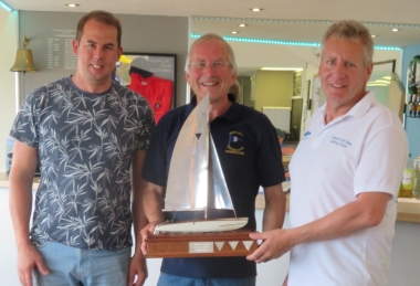 Brian Allen (right) and Dan Brzezinski (left) being presented with the David Foster Catamaran Challenge from Gunfleet Commodore Richard Walker