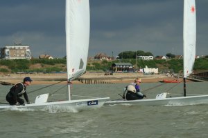 Husband and wife Matt and Yvonne Gough battle it out in their Lasers during the RNLI Charity Shield Race