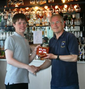 Robert Gutteridge is presented with his trophy for being the first Cadet home in the RNLI Charity Shield race
