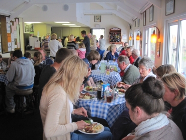 Members and guests tuck in to minted lamb chops, chicken kebabs, marinated spare ribs and chicken drumsticks