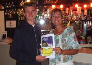 Owen is presented with his certificate for the most spectacular boat landing