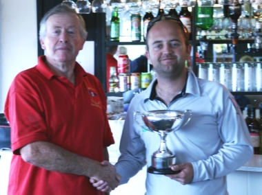 Nathan Batchelor from Tynemouth Sailing Club is presented with the Solution National Championship Trophy by Gunfleet's Malcolm Jolly