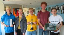 The winners of the 2018 Gunfleet Splash.  In the centre is Topper winner Korben Symmonds flanked on his left by Topaz champions Thomas Aiken and Francesca Cottee, and on his right top 405 sailors Ed Philpot and Henry Spooner