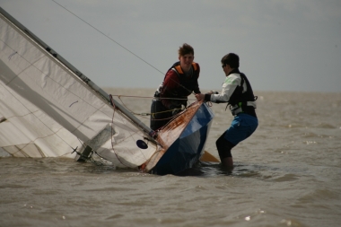 Desperately hoping nobody spotted them - Jack and Elliot Berry hurriedly right their Fireball after an unexpected capsize whilst racing in Spring Series 3