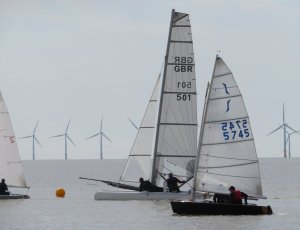 Brian Allen and Robert Mitchell take their F18 catamaran through the fleet at the start of the first race in the Spring Series