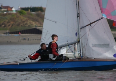 Father and son Paul and Elliot Berry fly the spinnaker in their Fireball