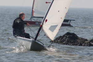 Taking a chance - Paul Stanton tacks close to the fishtail groynes in the race