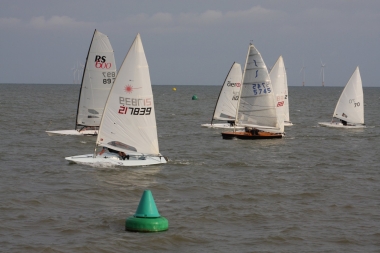 Andy Dunnett, in the Laser, holds his own against Ken Potts's RS600 in the forth race of the Summer Series