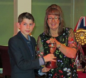 Ted Newson is presented with the Double G Trophy for first Topper home, by Helen Swinbourne
