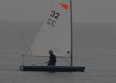 Race winner Peter Downer glances back to his nearest rivals as he crosses the finishing line