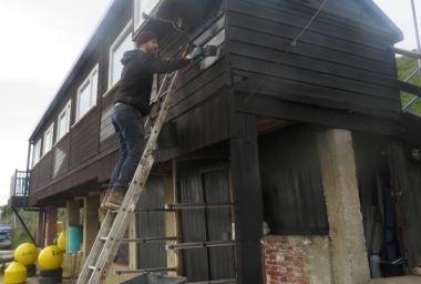 Andy slaps some creosote onto the Clubhouse