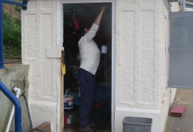 Val applies undercoat to the Pagoda door